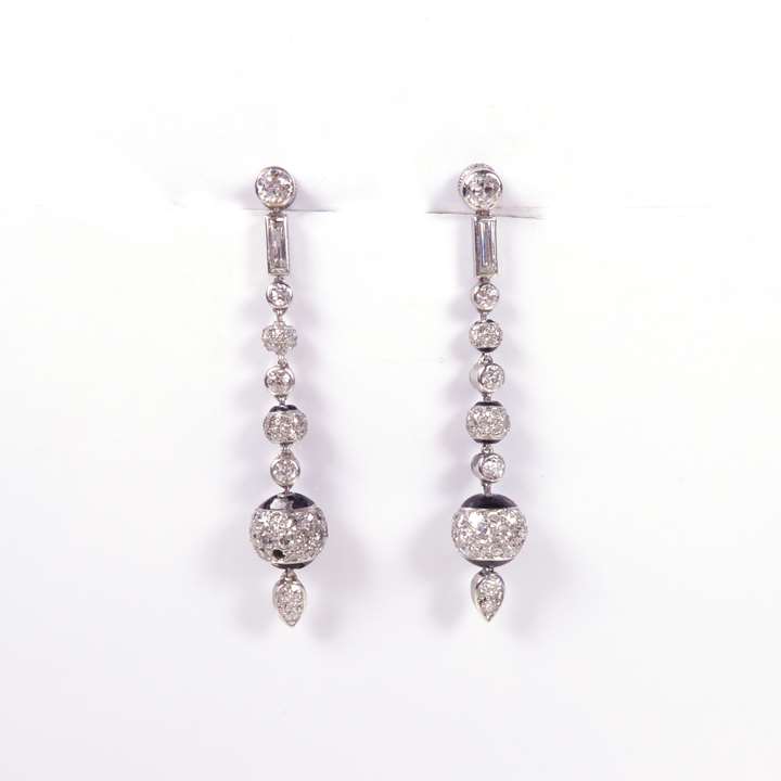 Pair of early Art Deco graduated diamond ball and black enamel pendant earrings